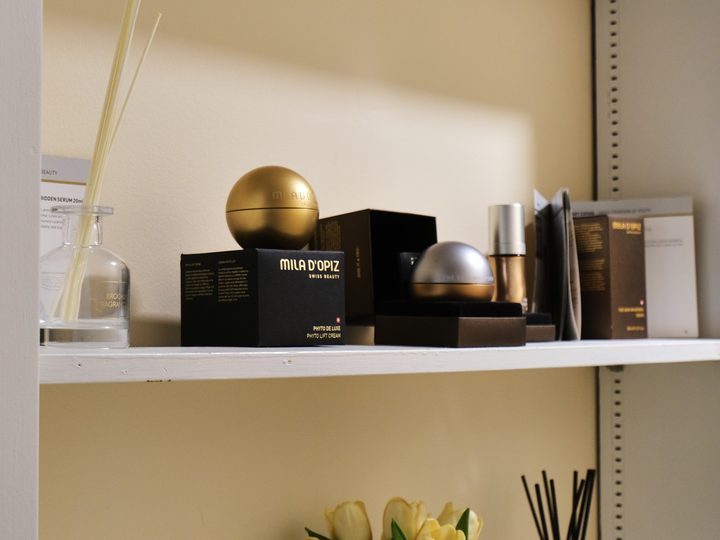 A shelf of skincare products in the clinic